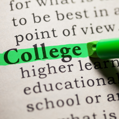 Photograph of a page of text with the word College highlighted in Green