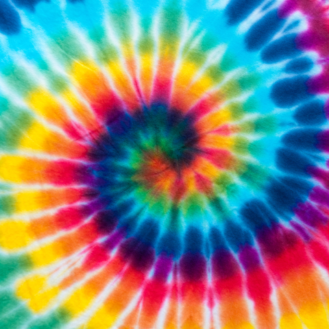 Image of a swirling tie-dye pattern in rainbow colors