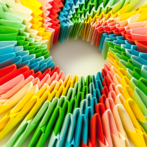 A rainbow of folded origami paper