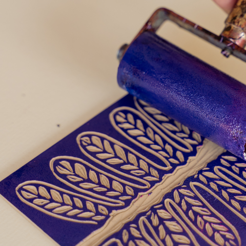 Image of a stamp being coated in ink