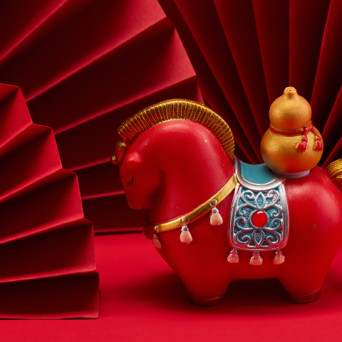 Image of a horse figurine on a red background