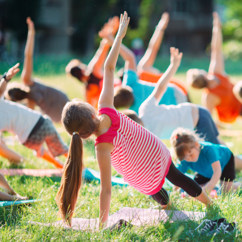 Image of kids doing yoga outside