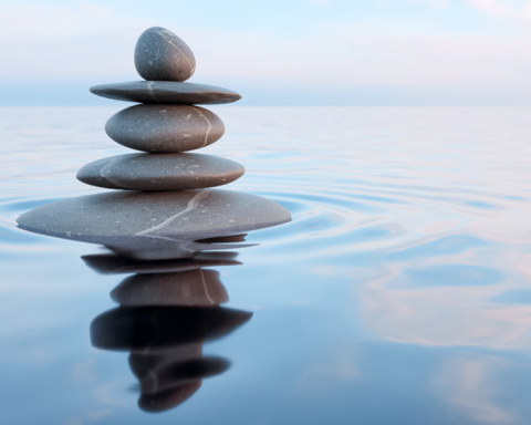 Image of rocks stacked of calm water