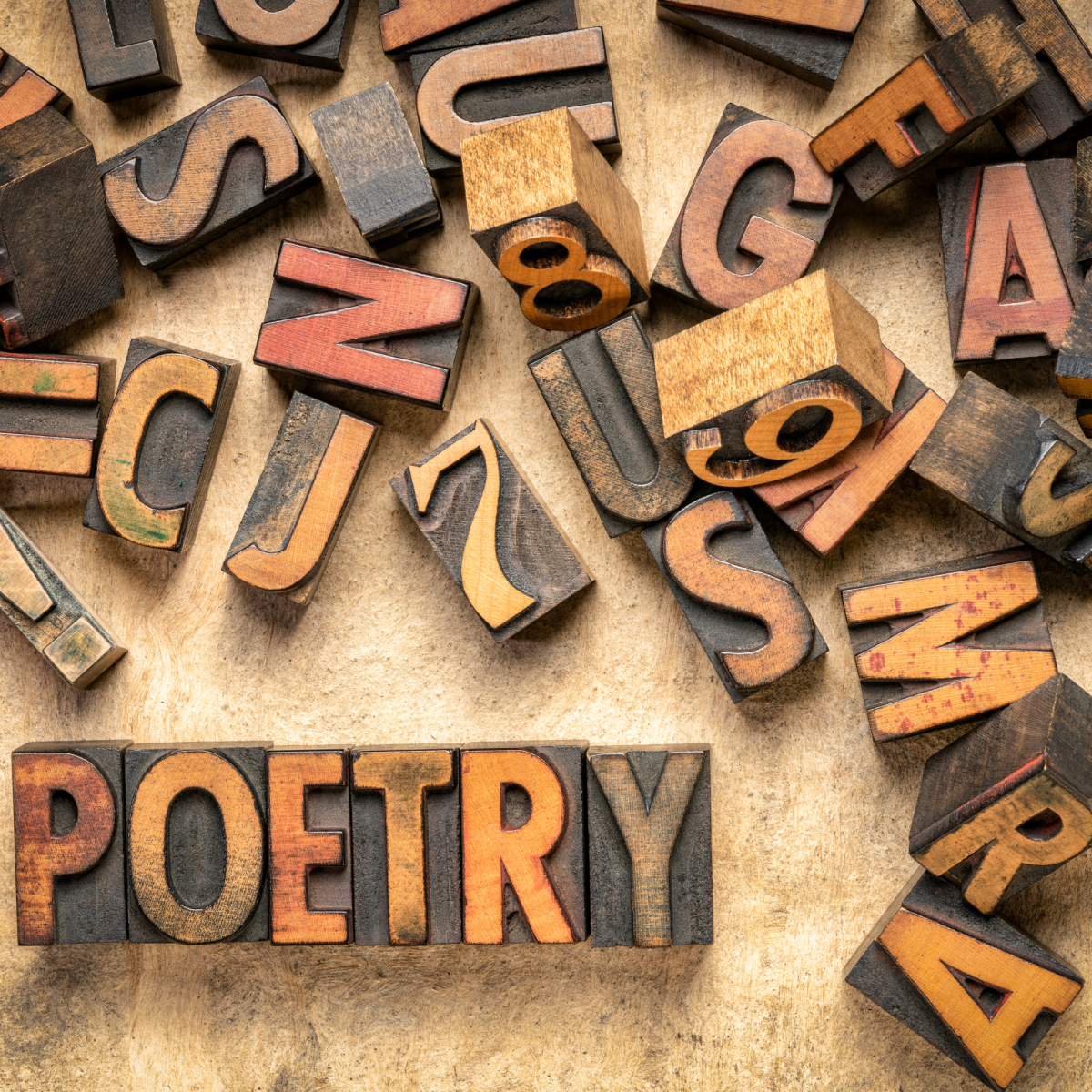Image of wooden letters with one word spelled out "Poetry"