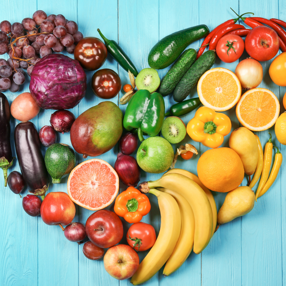 Image of a heart shape made out of colorful fruits and vegetables