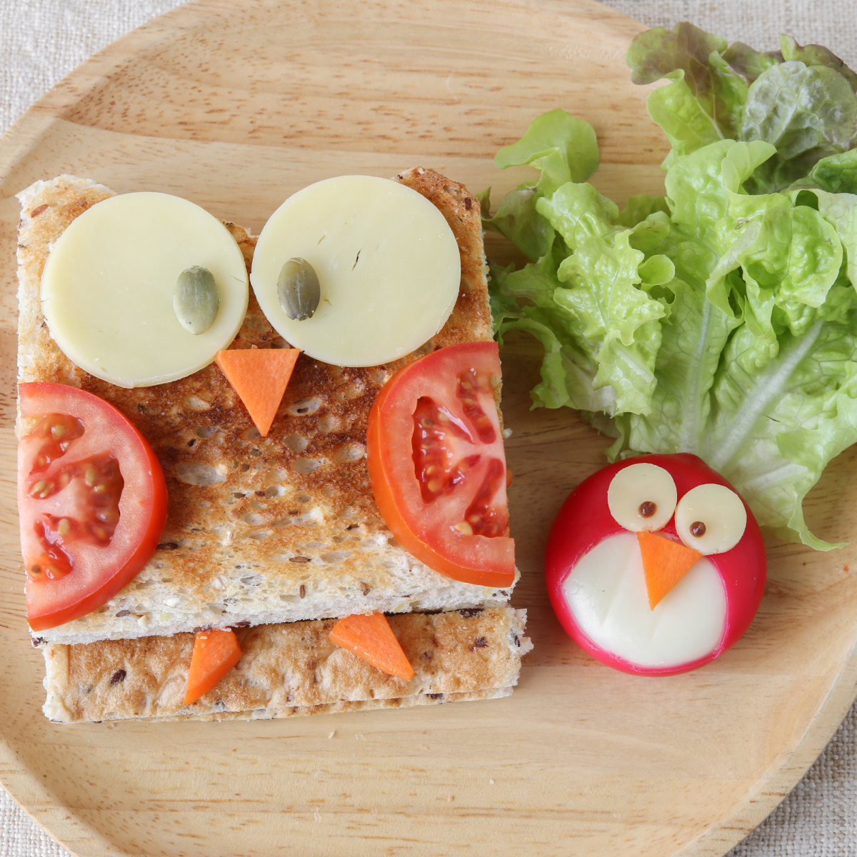 Image of a creative sandwich in the shape of an owl and a bird