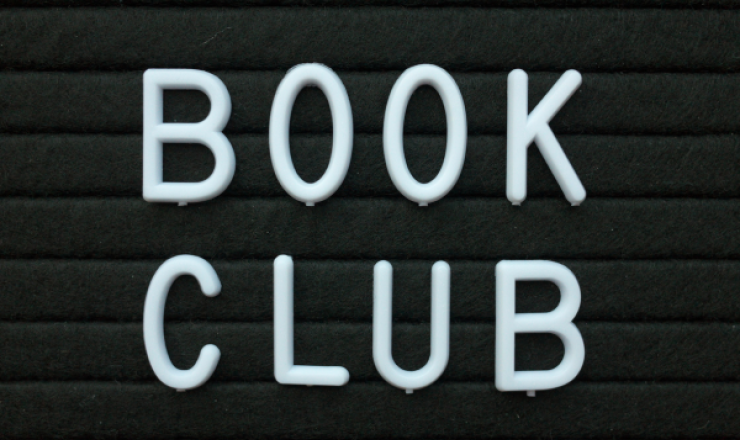 Image of a felt board with Book Club in white letters